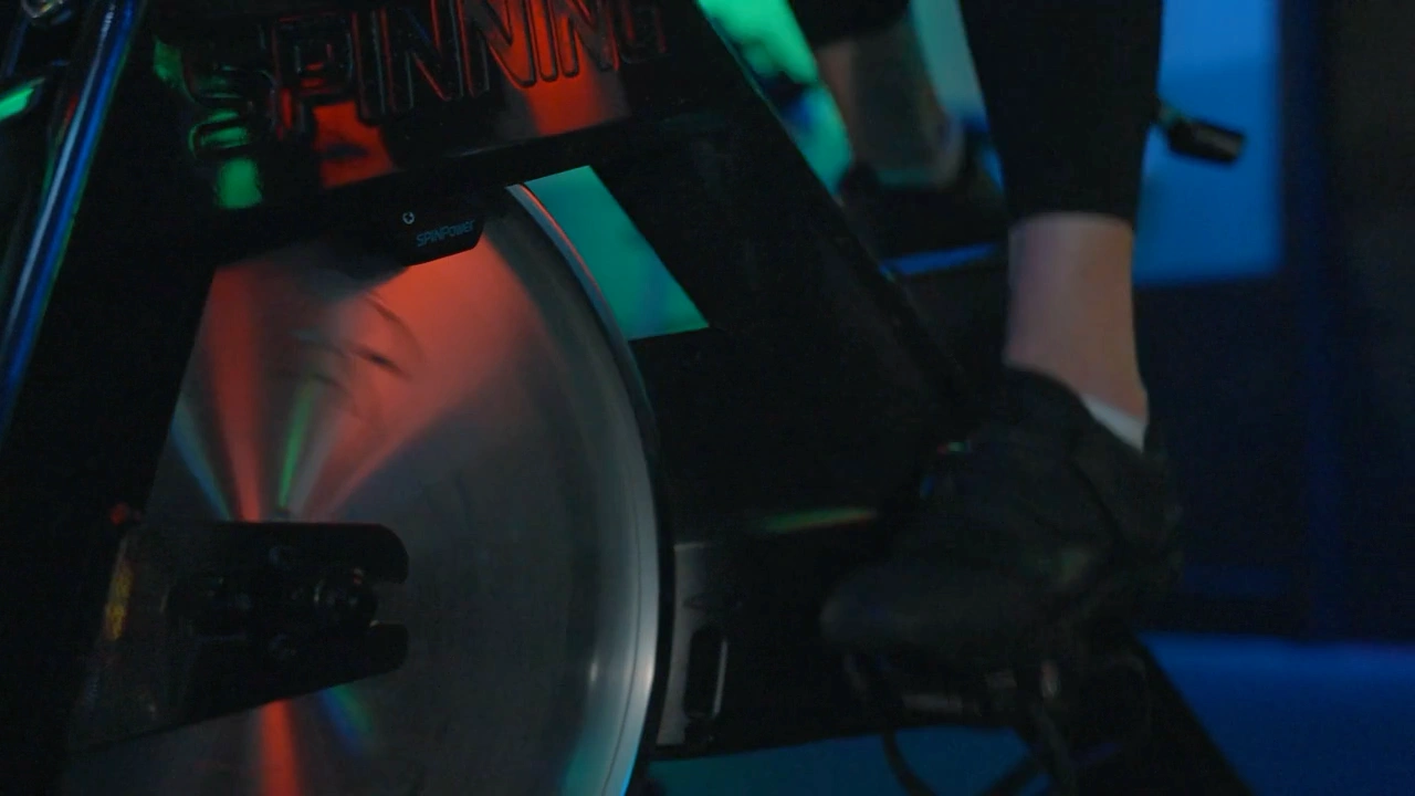 Close-up of Studio Spin cycling equipment under the studio lights.