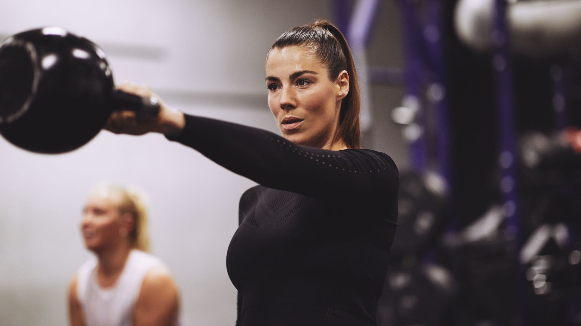 A woman lifting weights.