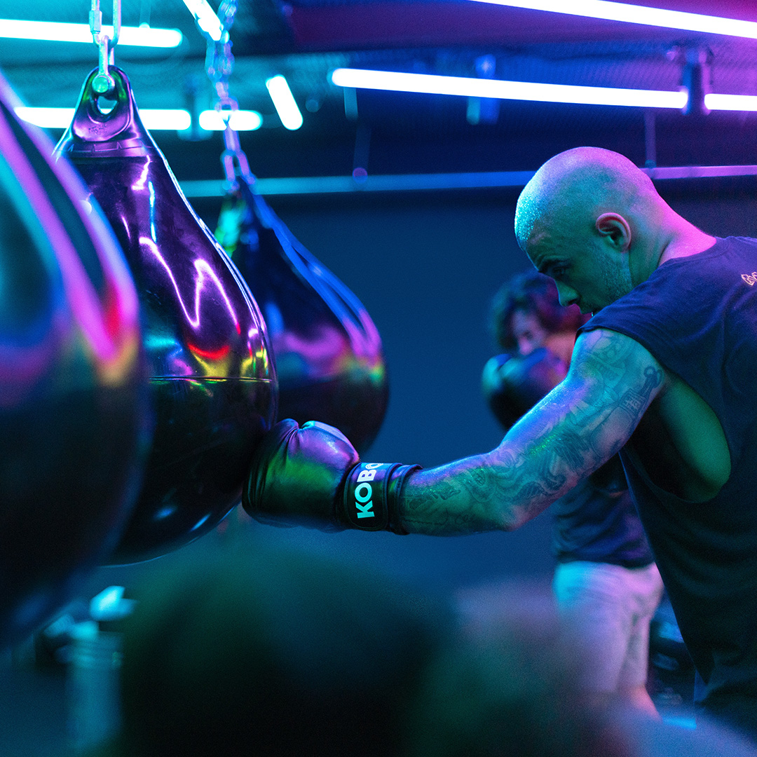 A man in a Rumble boxing fitness class
