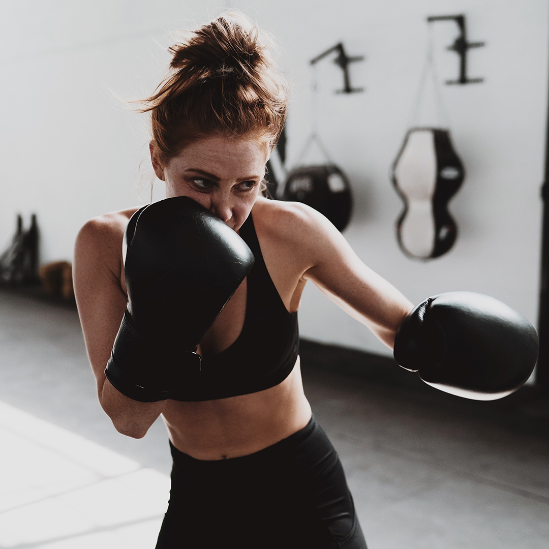 A woman in a boxing fitness class