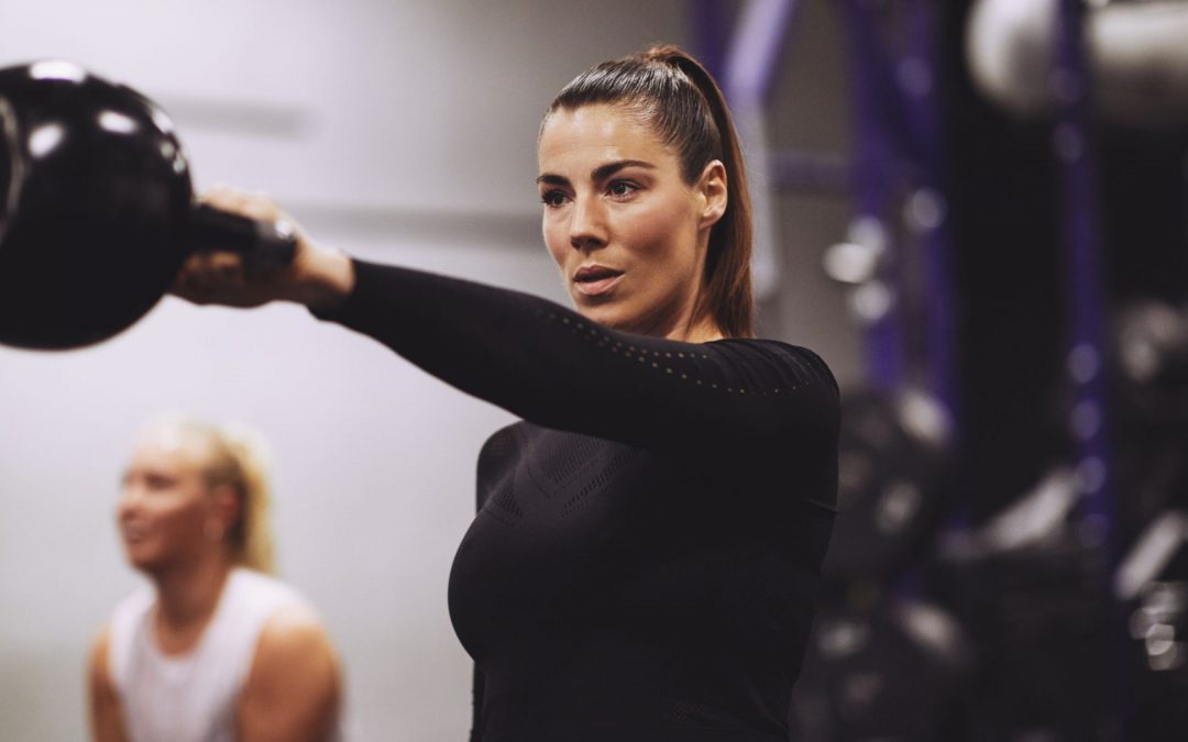 A woman lifting weights.